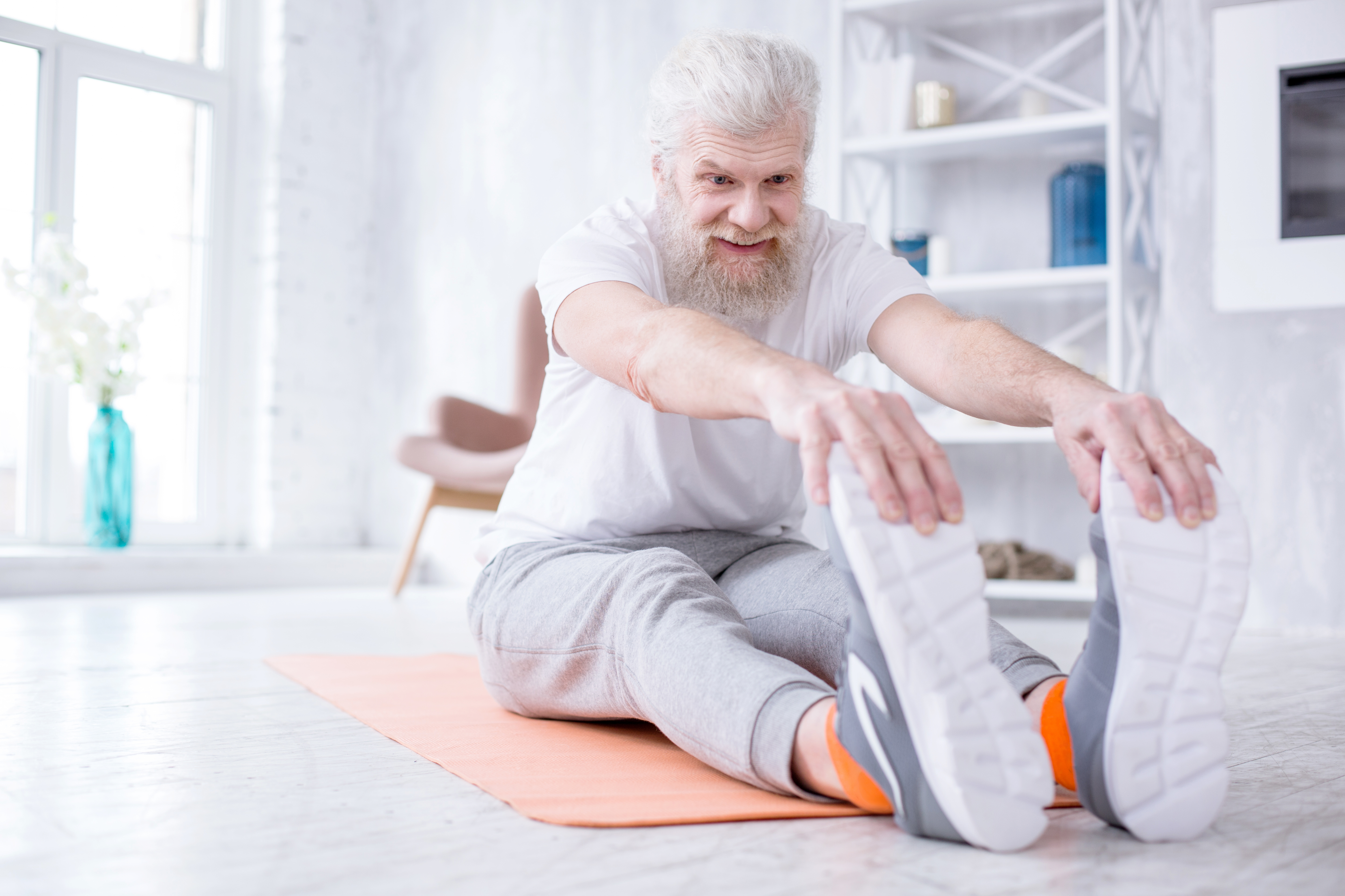elderly man stretching