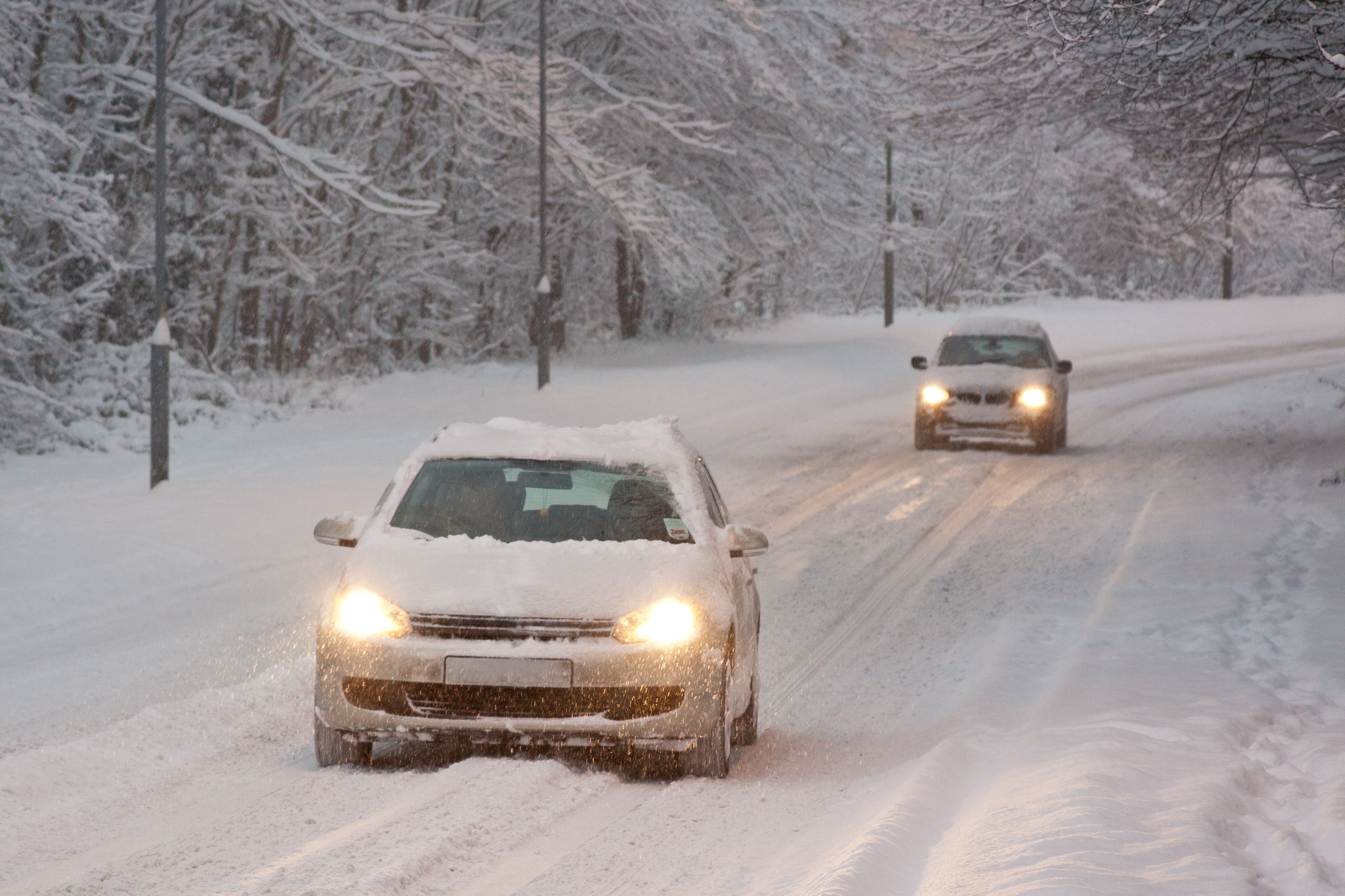cars driving in deep snow