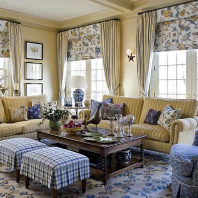 blue and yellow floral needlepoint rug allows you to use yellow, gold, blue and white fabrics which will make a living room feel inviting in both summer and winter.