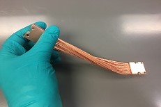 Optical system waste heat strap