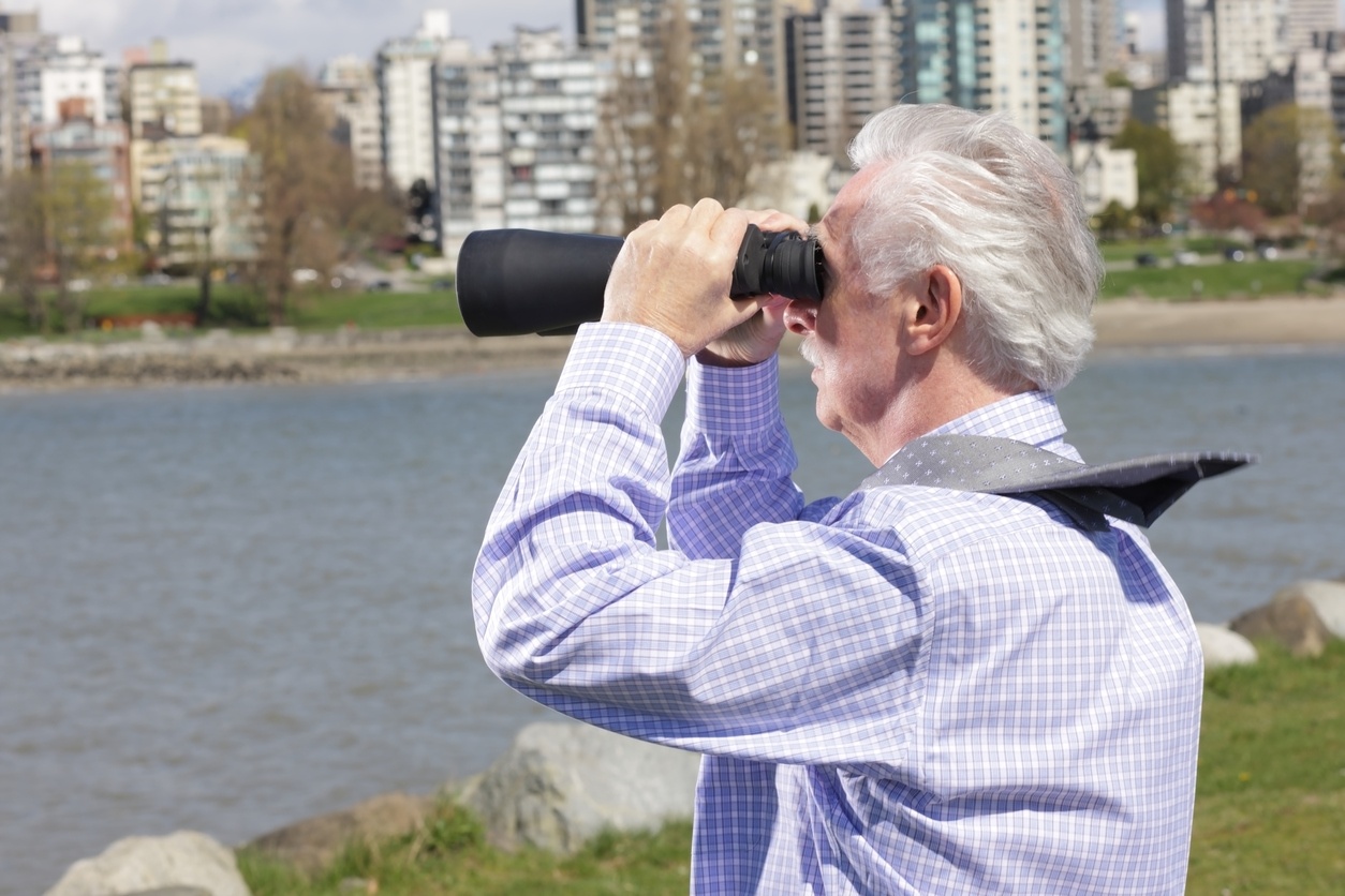 man with binoculars in the wind