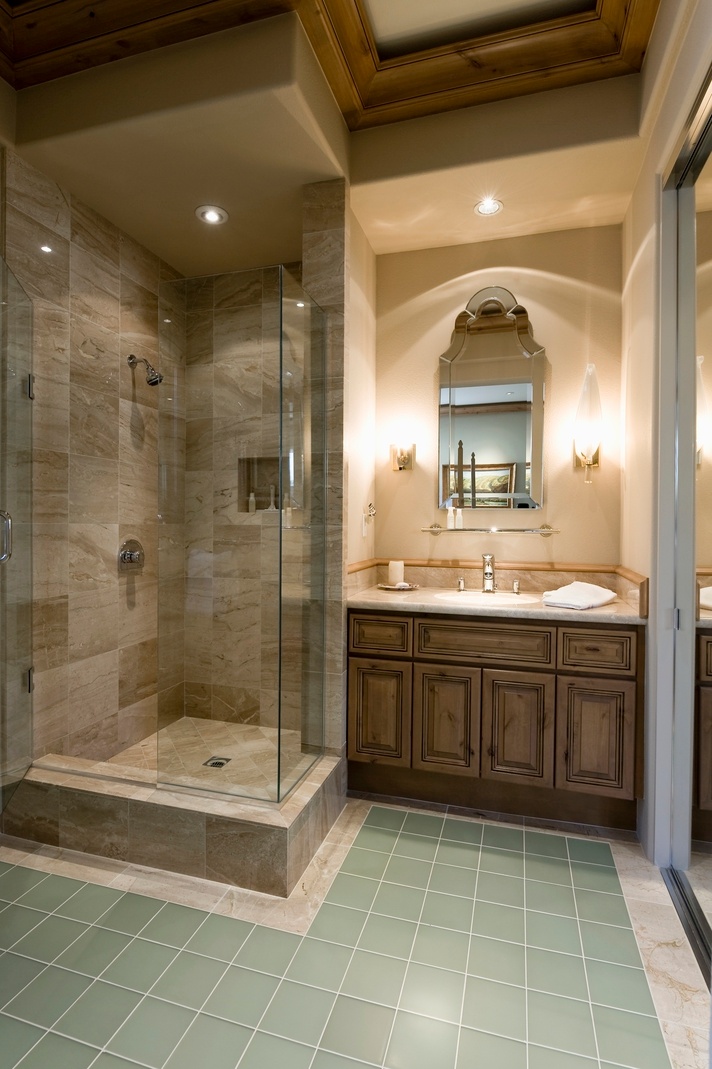green tile bathroom with contemporary glass tile shower