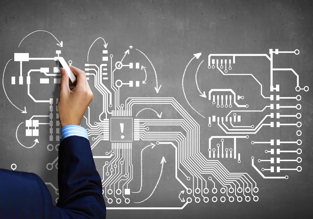 Close up image human hand drawing circuit board.jpeg