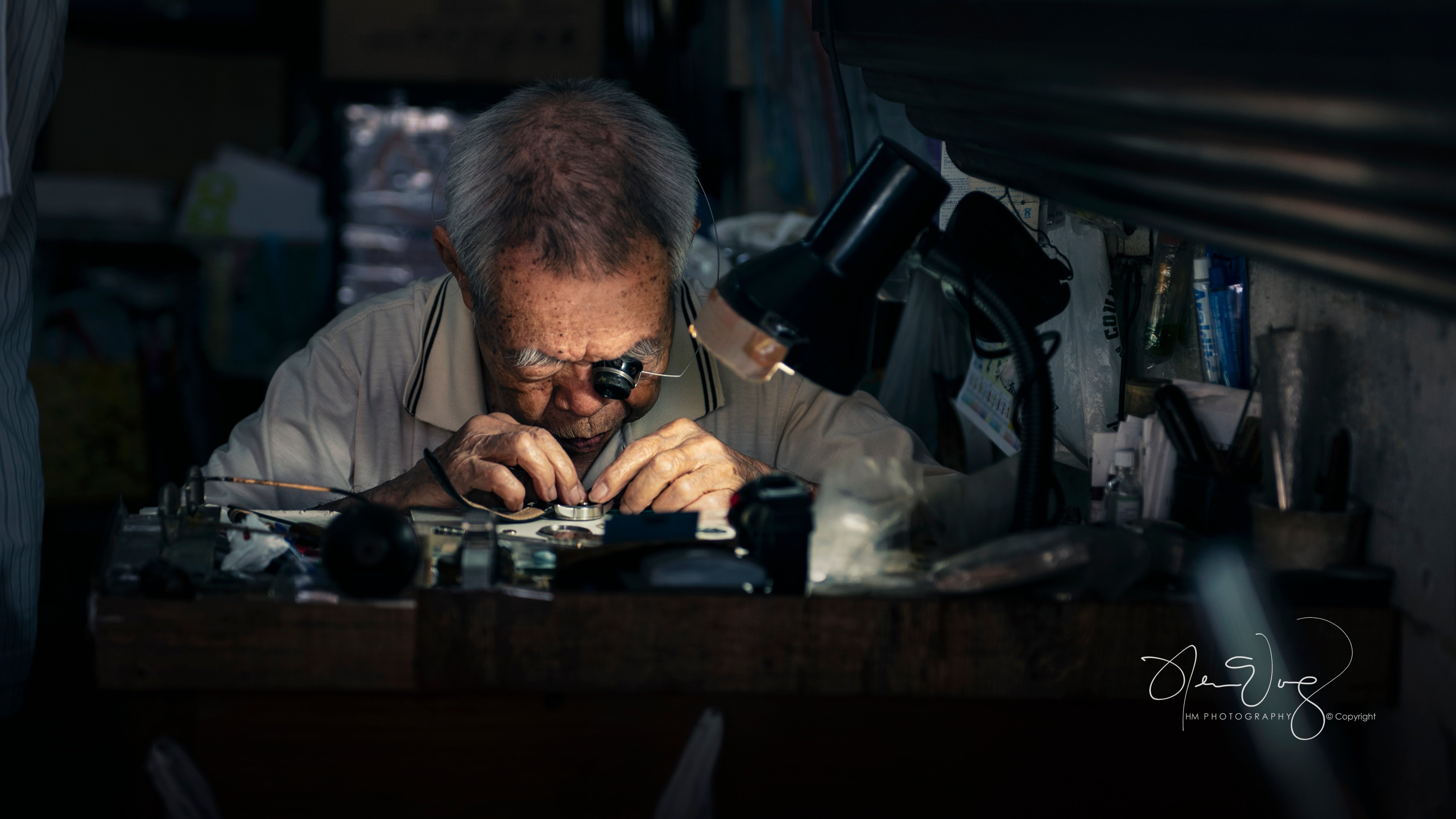 A horologist hard at work making a watch by hand