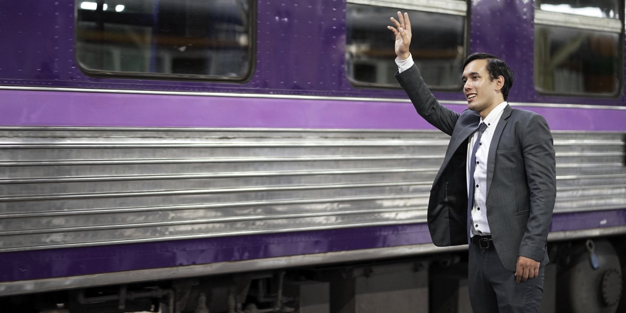 The train has. Waiting at the Train Station. Man on the Train. Business man into the Train. Two men on the Train.