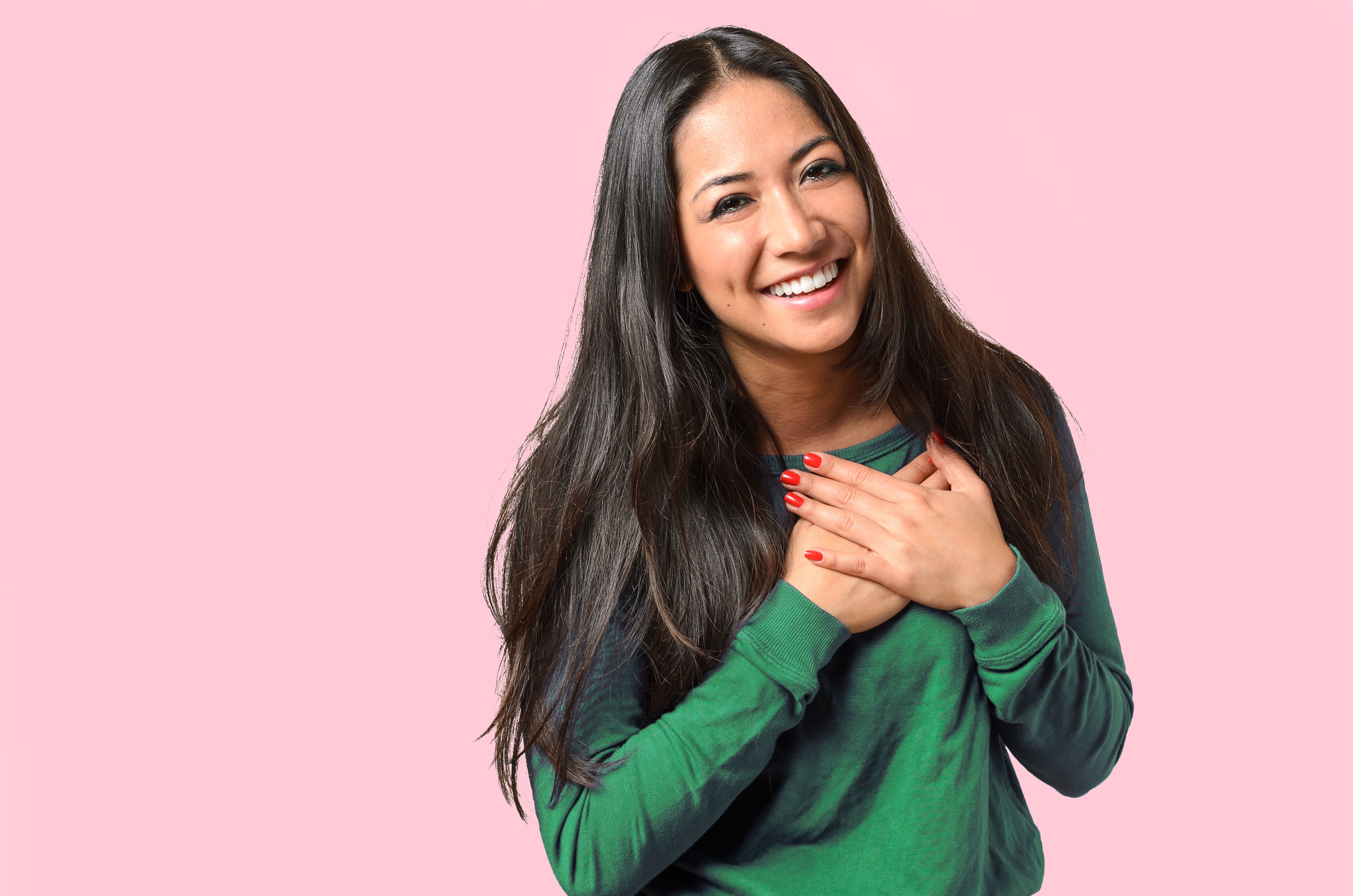 Woman Blushing on a Pink Background