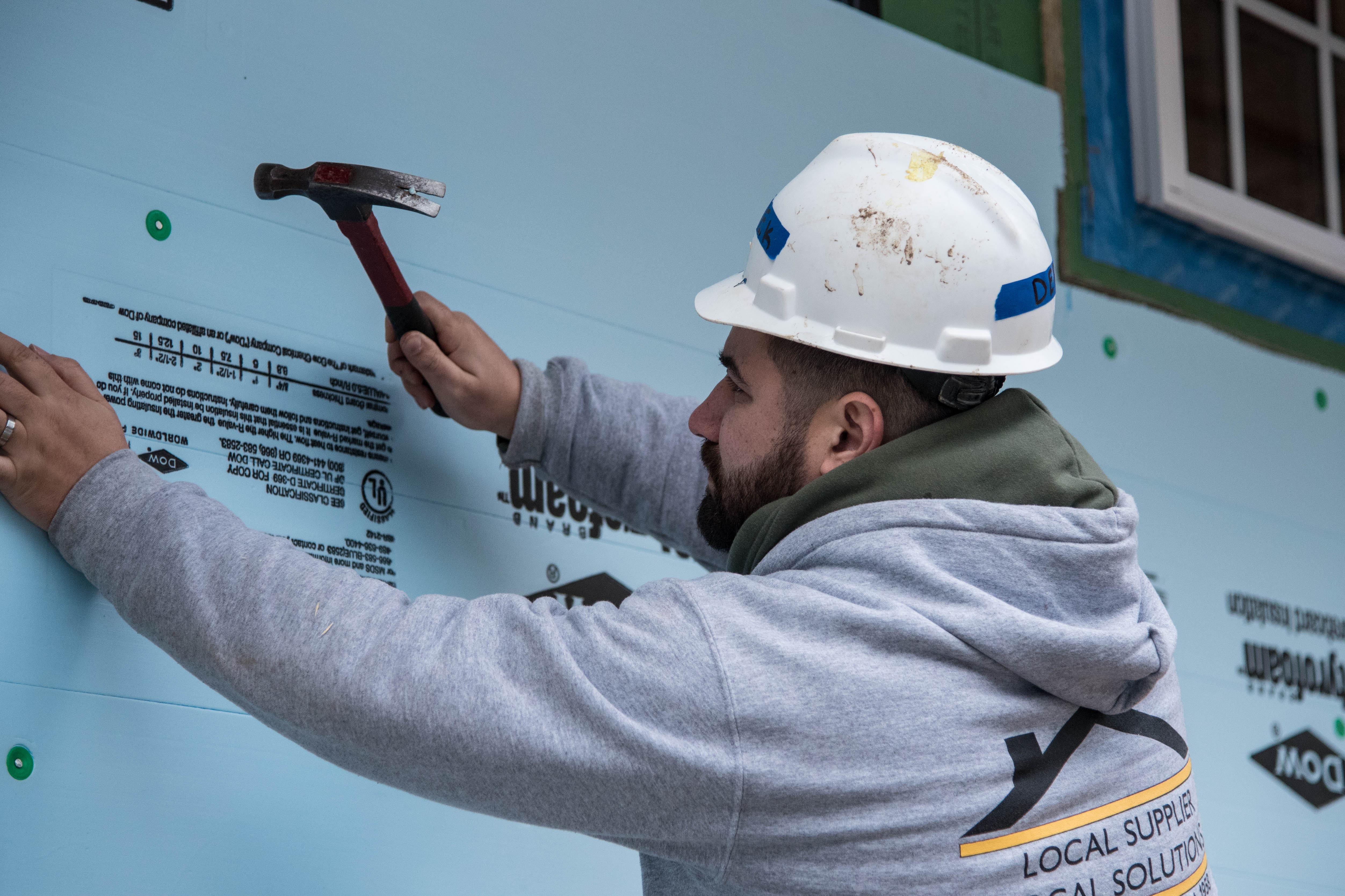 Habitat for Humanity CCL volunteer Derek on a build site