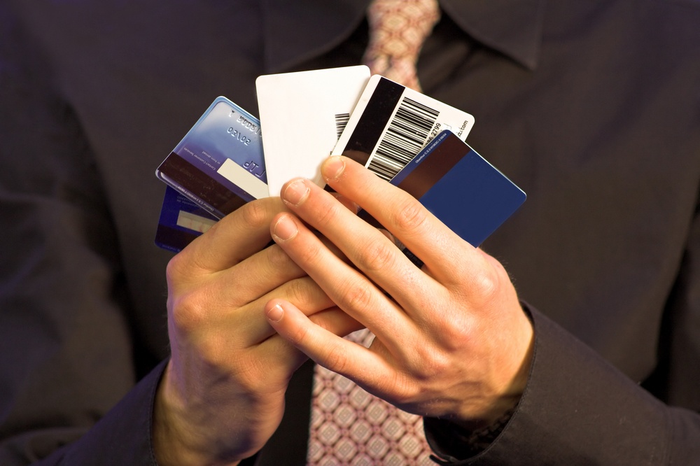 business man holding credit cards.jpeg