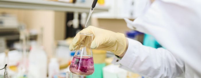 Holding-Burette-with-Chemical-in-Lab