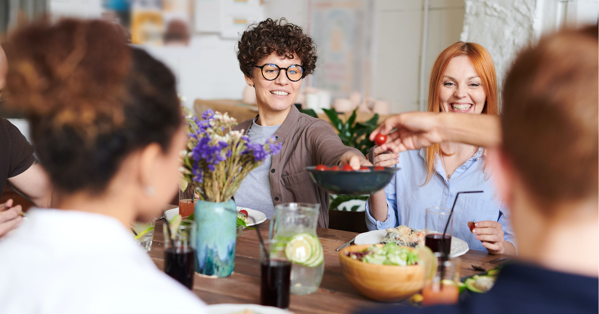 friends sharing potluck style meal