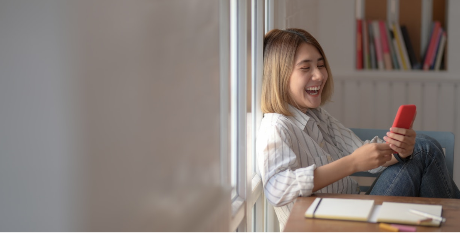 woman laughing on phone
