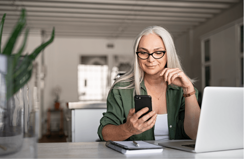 Senior Woman on Smartphone in House