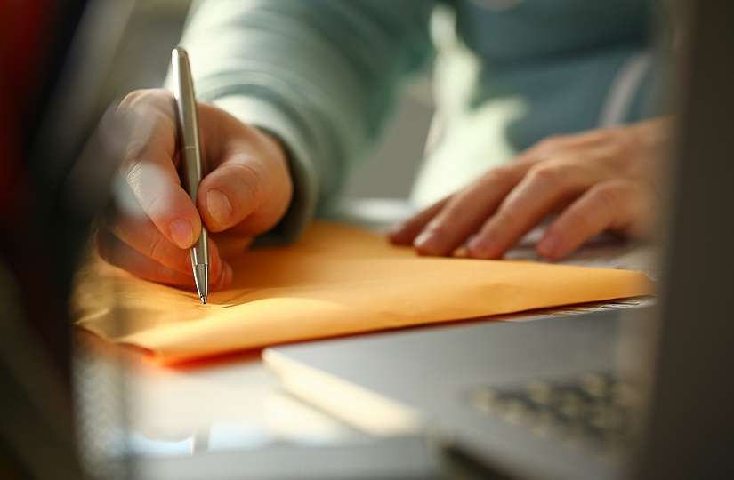 Applicant Filling out Address on Folder