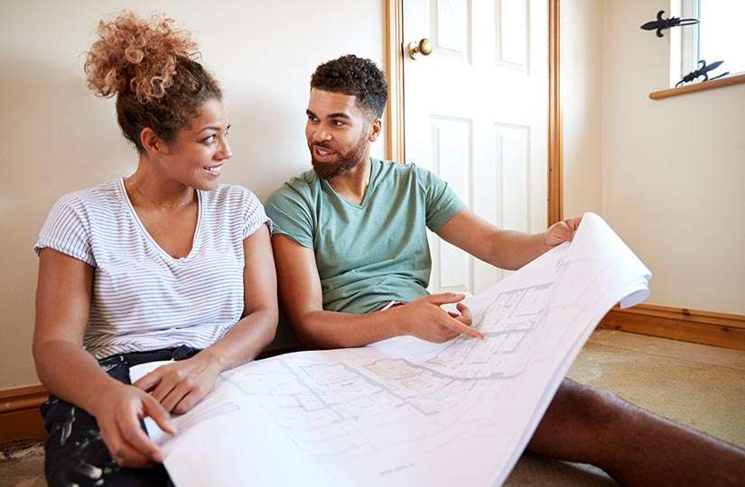 couple looking over house plans