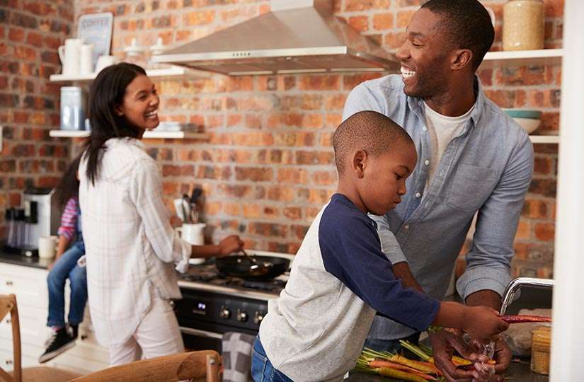 family making dinner in kitchen