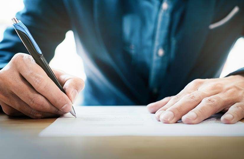 man filling out form