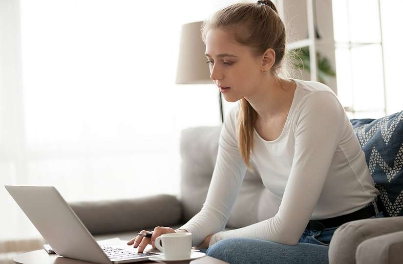 Student Applying Online on Couch
