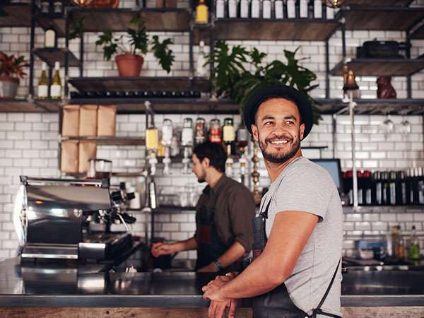 male cafe owner smiling
