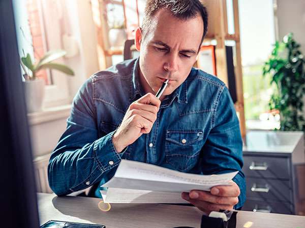 man checking paperwork
