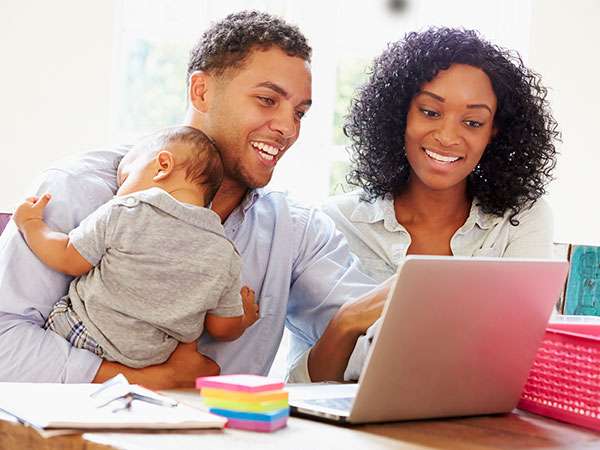 parents researching on laptop