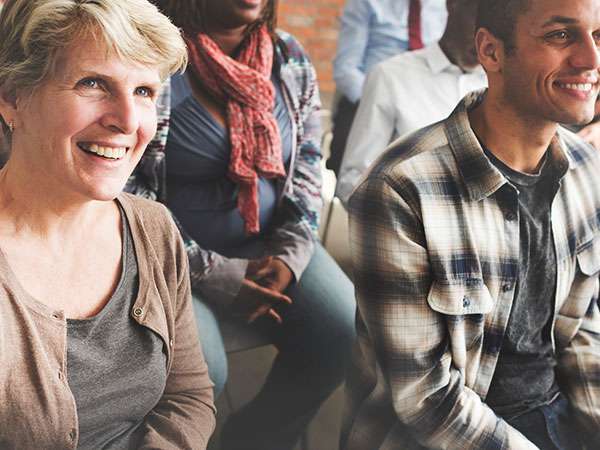 People Listening at a Meeting