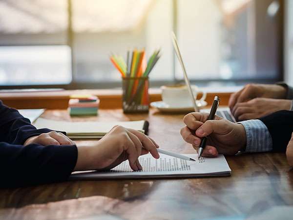 home buyer signing a contract