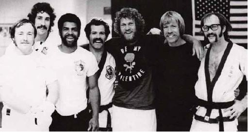  Pat Johnson (center) with Chuck Norris (second from right) and other students. 