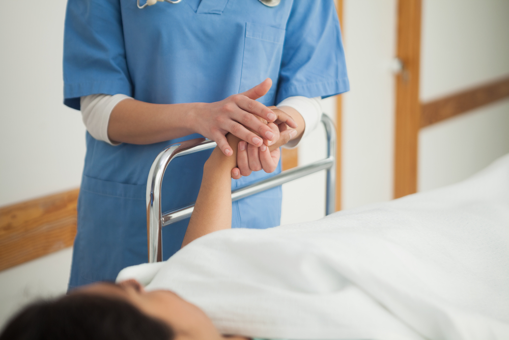 Nurse checking in on patient