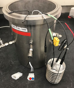 Connect each of the leads from the multimeter onto each male prong on the exterior heater gland that is connected to the Guard heater