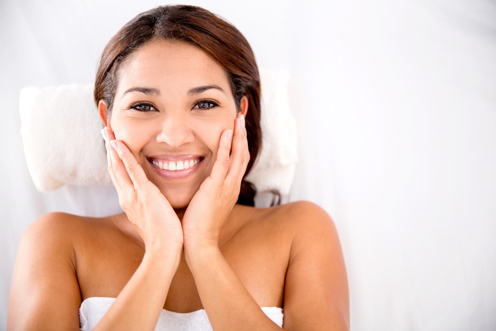 Beautiful woman at the spa lying on a bed for a massage