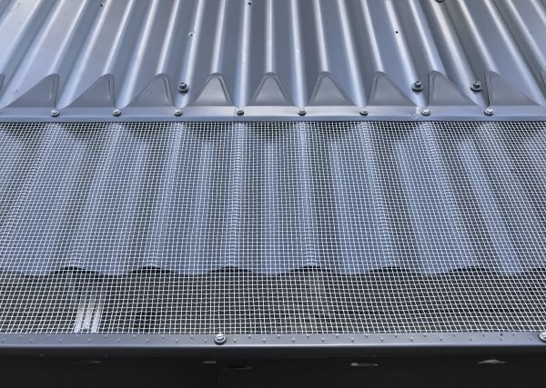 Blue Mountain Mesh Gutter Guard installed on corrugated metal roof