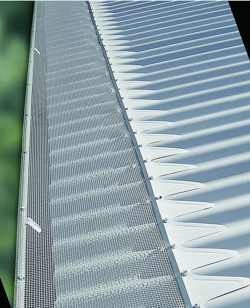 Blue mountain mesh gutter guard installed to gutters on metal roof