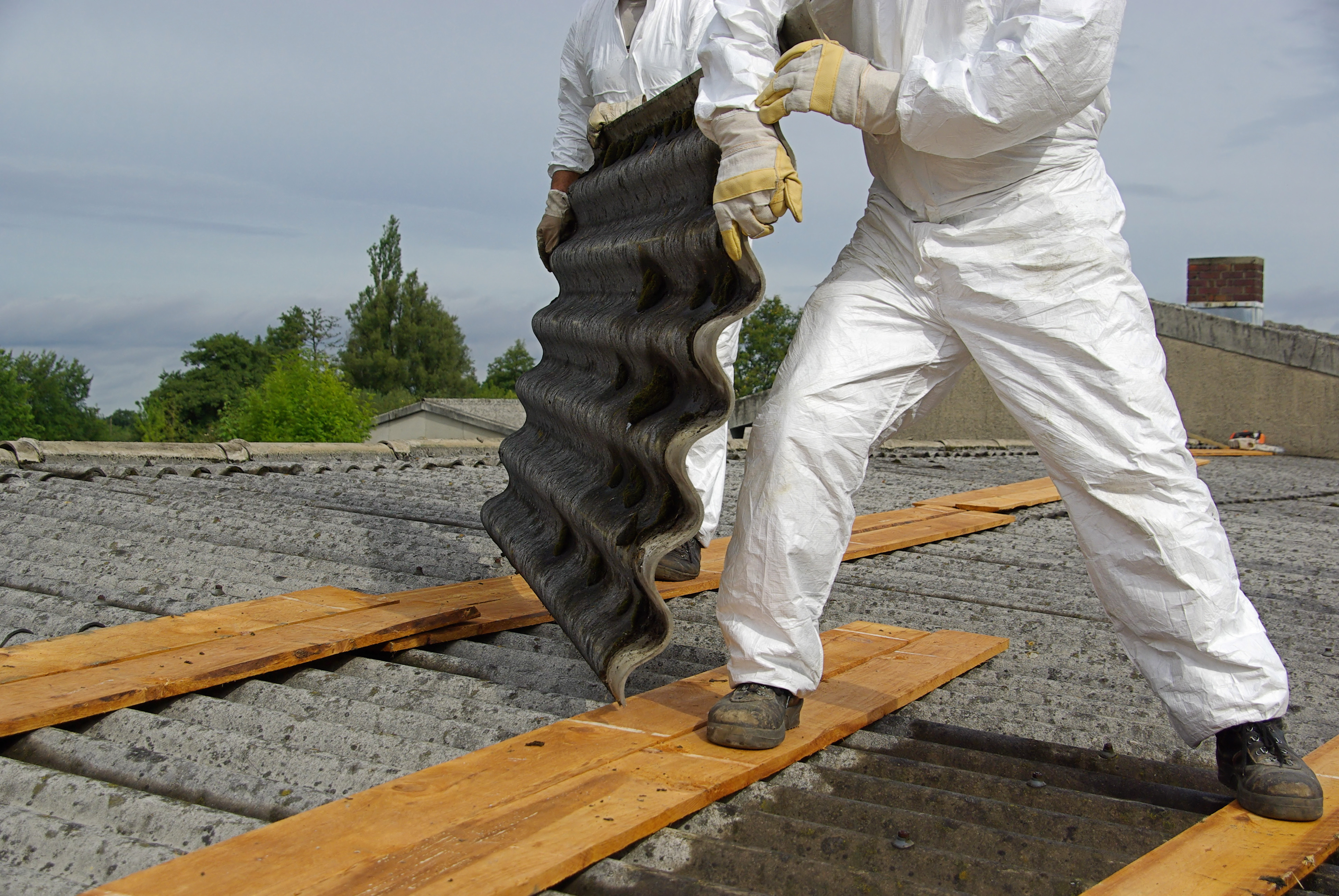 Qualified tradespeople removed asbestos roof sheeting