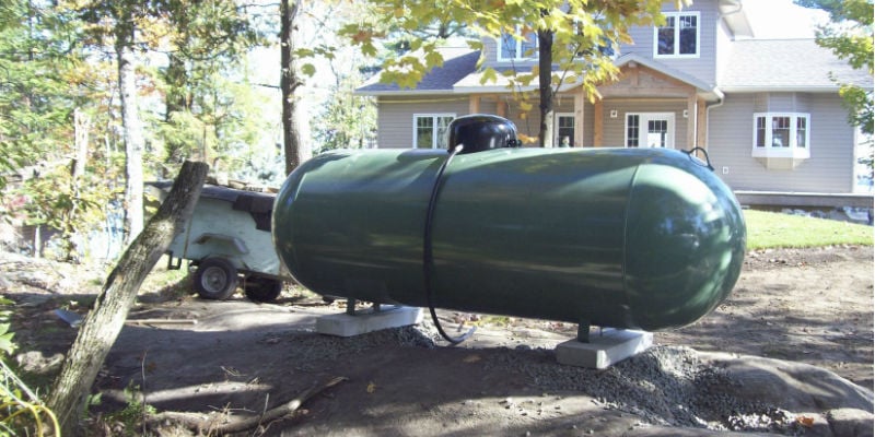 Why is propane stored in household tanks but natural gas is not