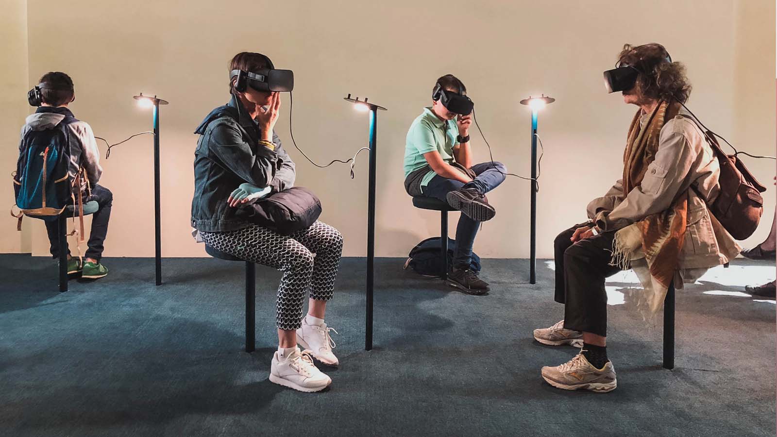 four individuals of different ages wearing VR headsets