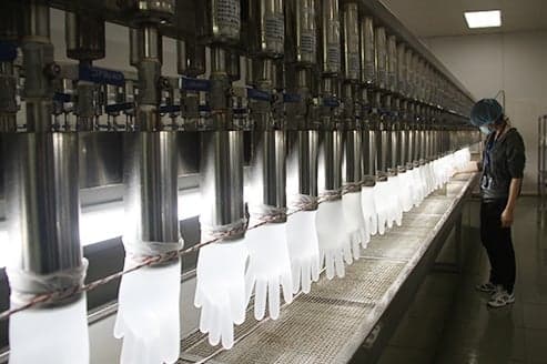 Disposable Nitrile Glove Factory Worker Checks Gloves