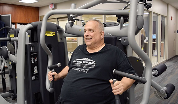 Image of Larry Using Exercise Equiptment Inside LiveHealthy Fitness Center