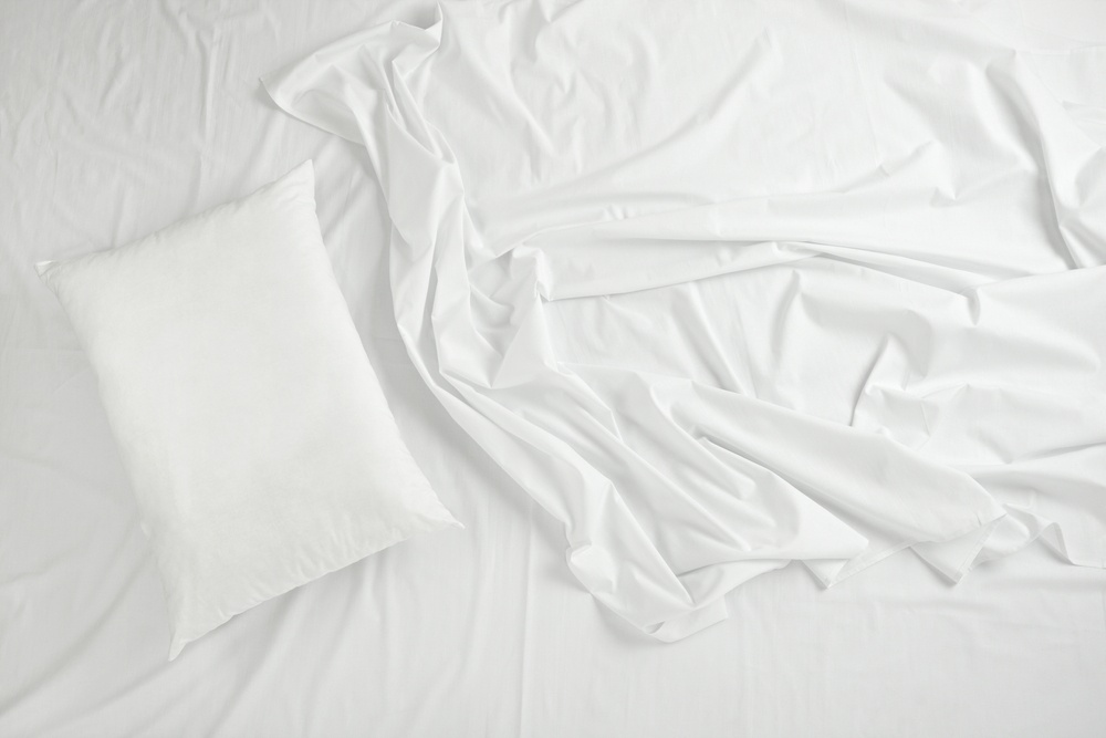 close up of bedding sheets and pillow.jpeg