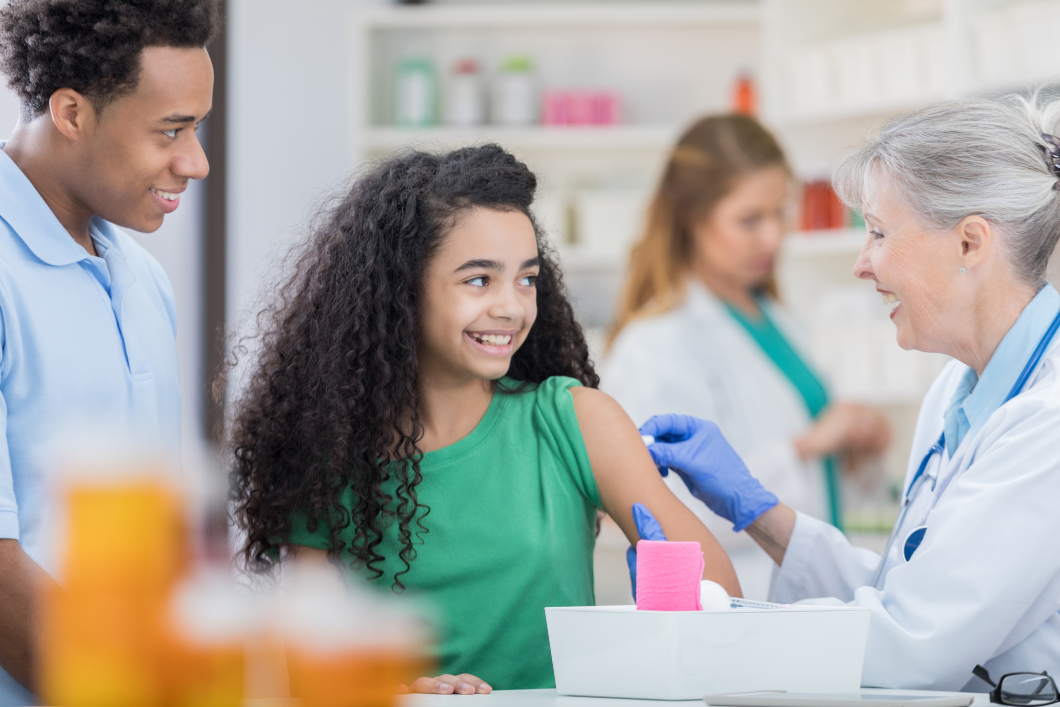 A young girl receiving the HPV vaccine