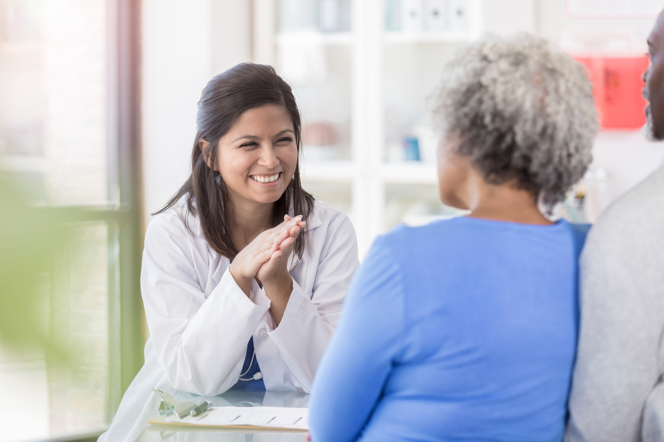 Female doctor consulting weight loss patient