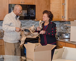 couple packing kitchen