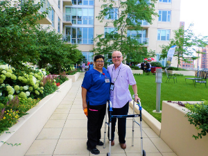  A man and his assisted living nurse at The Admiral at the Lake