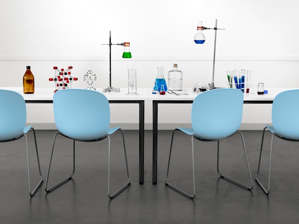 4 Sky blue RBM Noor chairs at a table with science experiments using glass tubes and colourful liquids