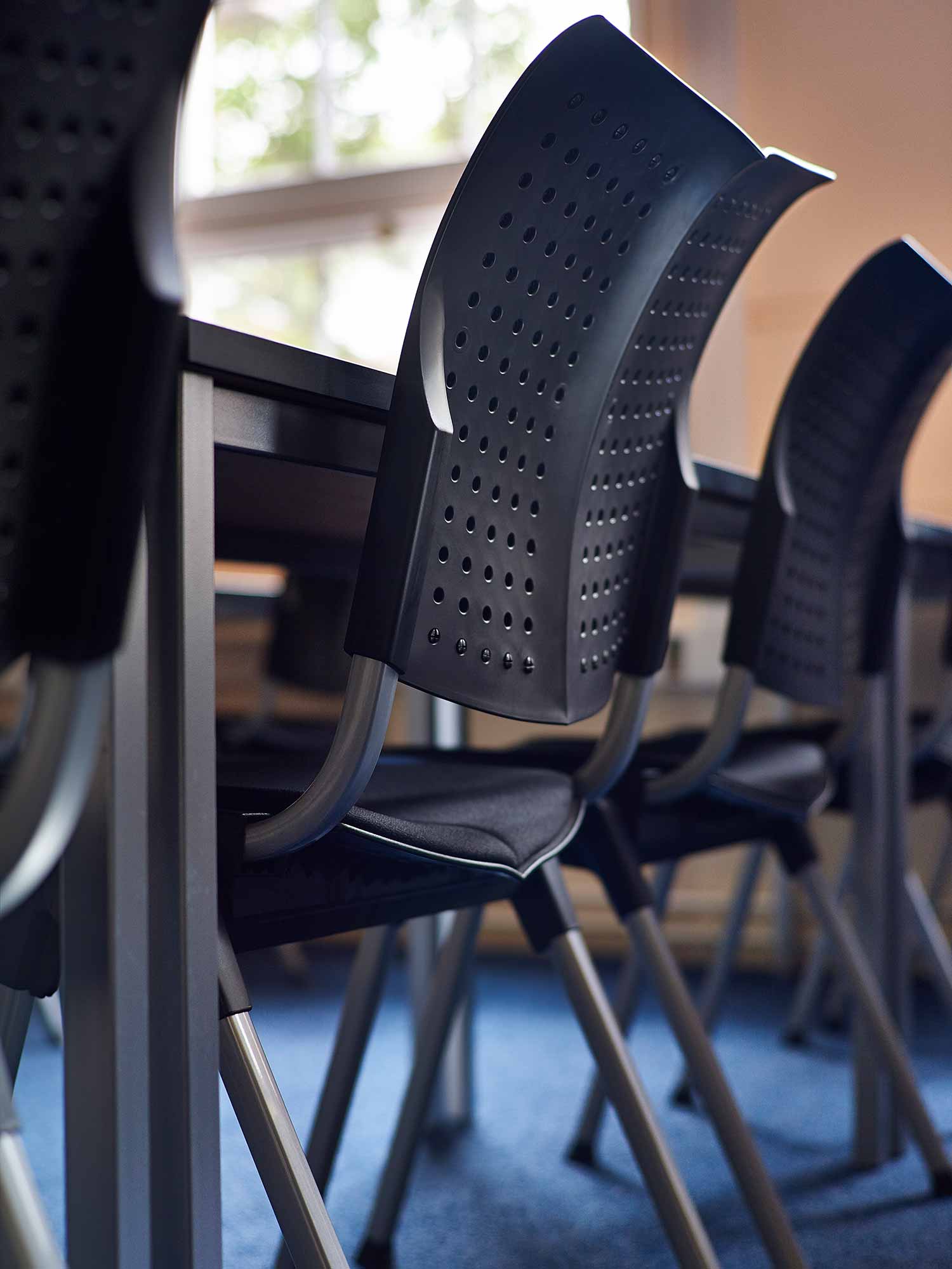 Close up photo of HÅG Convention Wing in black in classroom