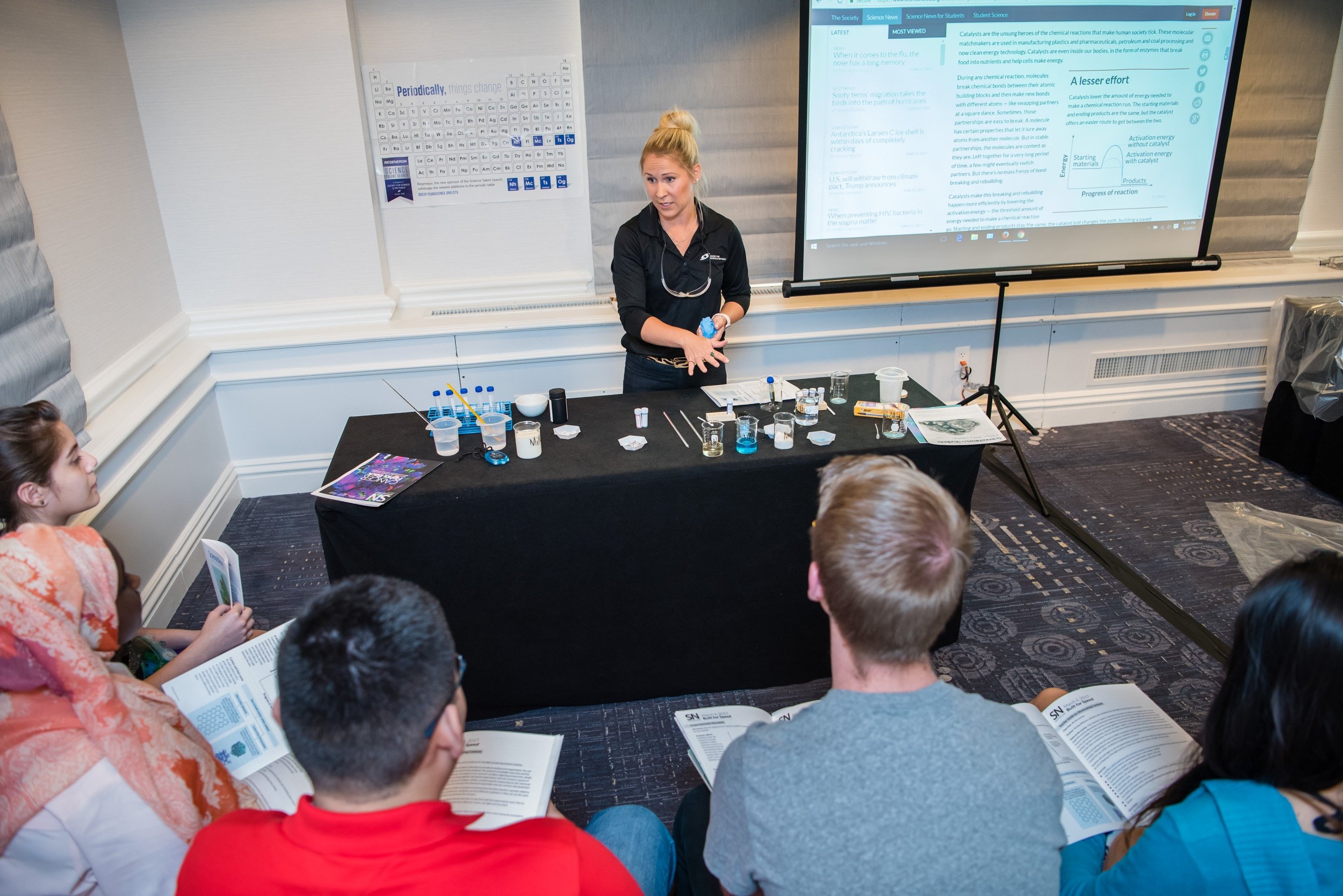 Society staff member Anna Rhymes prepares local students for a lab activity that the 2017 Advocates will test at the annual Advocate Training Institute. (Photo credit: Society for Science & the Public)