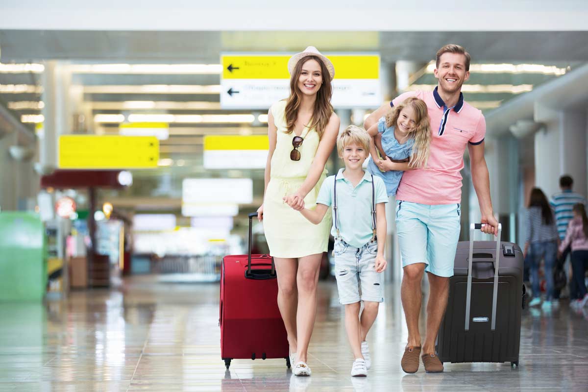 Family walking at airport