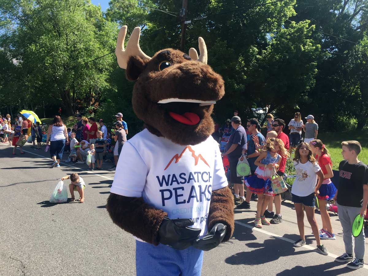 MONEY MOO$E walking down parade route