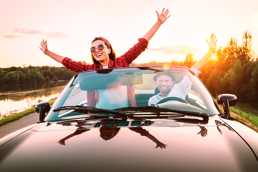 bigstock-Traveling-By-Car--Happy-Coupl-300317002