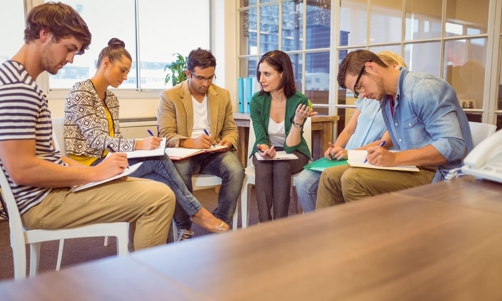 Attentive creative business team in meeting at office