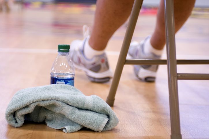 Woman sitting in a chair at the gym.